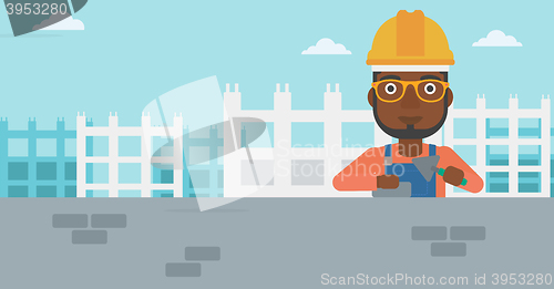 Image of Bricklayer with spatula and brick.