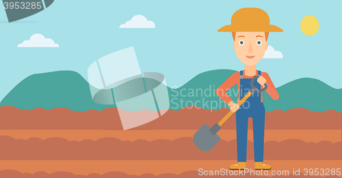 Image of Farmer on the field with shovel.