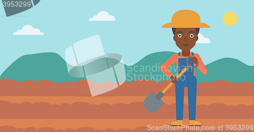 Image of Farmer on the field with shovel.