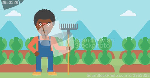 Image of Farmer with rake.