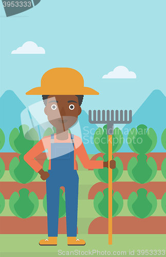 Image of Farmer with rake.