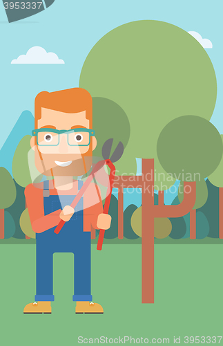 Image of Farmer with pruner in garden.