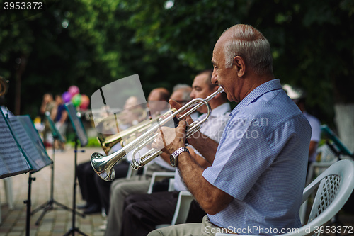 Image of Men play musical instruments