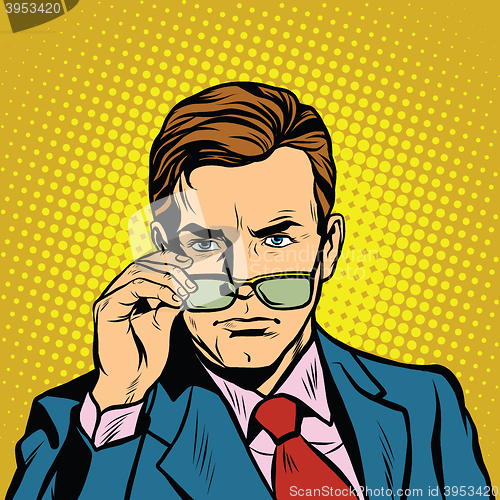 Image of The man takes off his glasses
