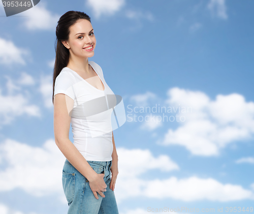 Image of happy young woman or teenage girl in white t-shirt