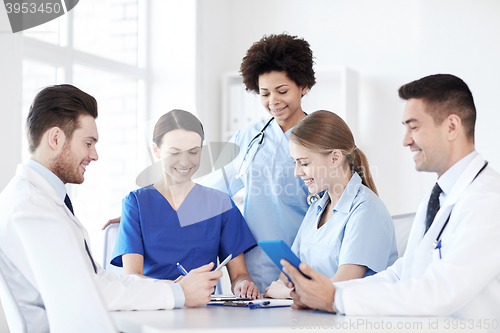Image of group of happy doctors meeting at hospital office