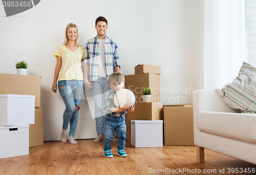 Image of happy family moving to new home and playing ball