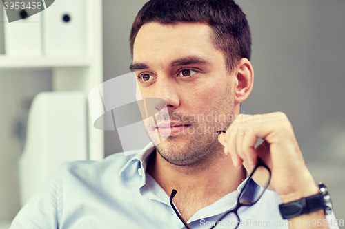 Image of portrait of businessman with eyeglasses at office