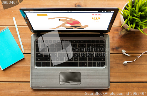 Image of close up of laptop computer with fitness app