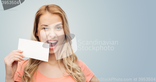 Image of happy woman or teen girl with blank white paper