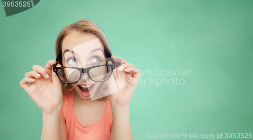 Image of happy young woman or teenage girl in eyeglasses