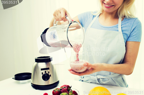 Image of close up of woman with blender and shake at home