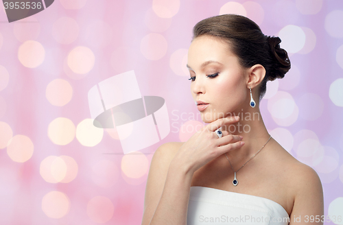 Image of beautiful woman with earring, ring and pendant