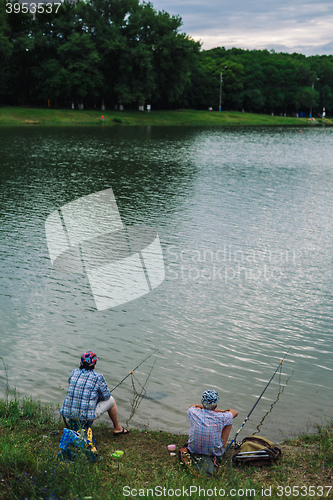 Image of Couple catches fish with a fishing rod