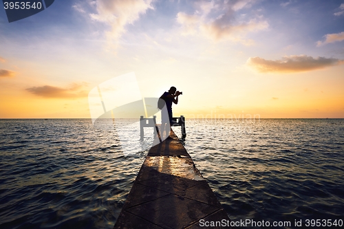 Image of Photographer at the sunset