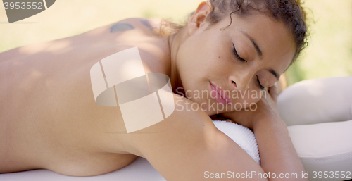 Image of Top down view of woman on massage table