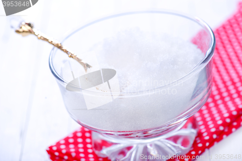 Image of white sugar in glass bank