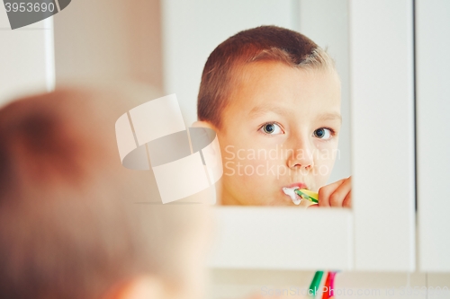 Image of Boy is cleaning teeth 