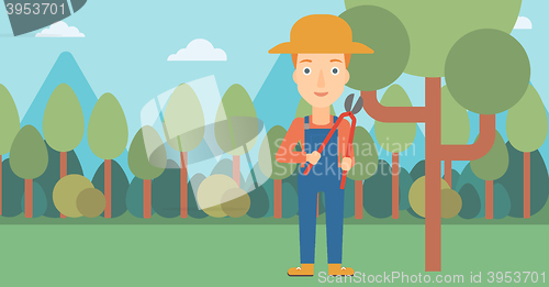 Image of Farmer with pruner in garden.