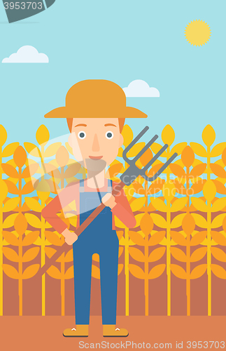 Image of Farmer with pitchfork.