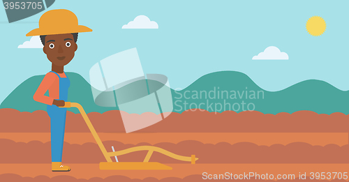 Image of Farmer on the field with plough.