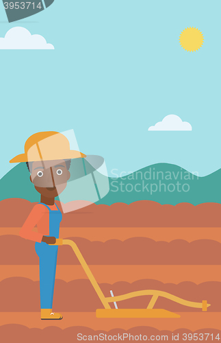 Image of Farmer on the field with plough.