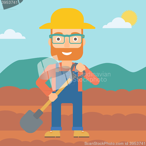 Image of Farmer on the field with shovel.