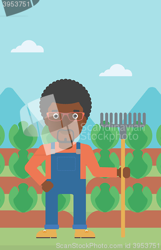 Image of Farmer with rake.