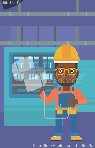 Image of Electrician with electrical equipment.