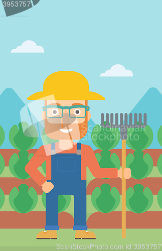 Image of Farmer with rake.