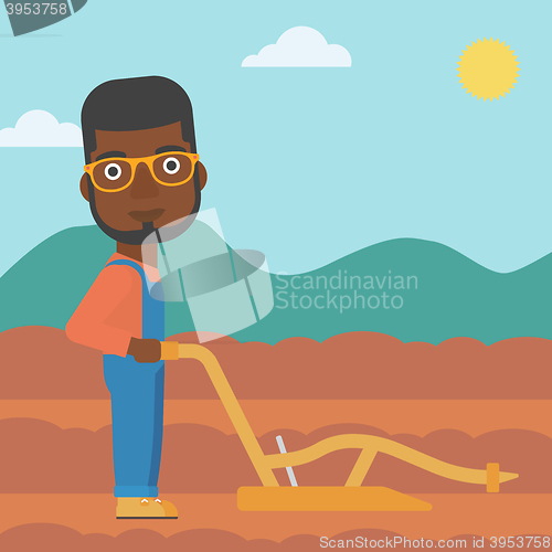 Image of Farmer on the field with plough.