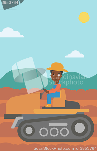 Image of Farmer driving tractor.