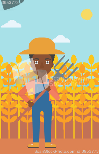 Image of Farmer with pitchfork.