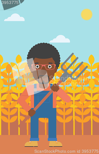 Image of Farmer with pitchfork.