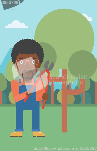 Image of Farmer with pruner in garden.