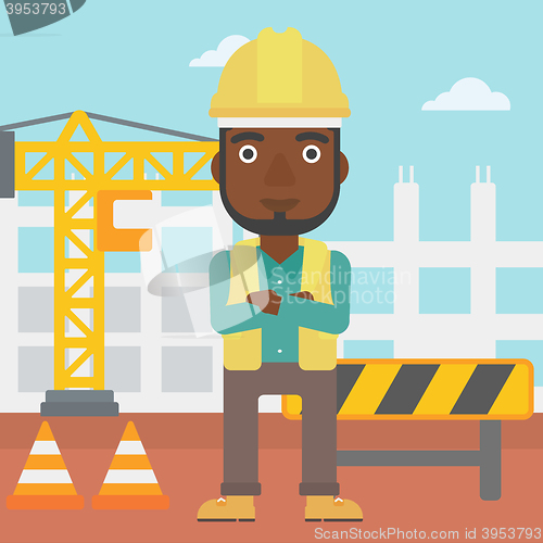 Image of Friendly builder with arms crossed.