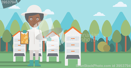 Image of Bee-keeper at apiary.