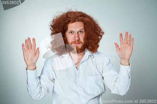 Image of The young surrendered man looking at camera