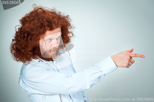 Image of The young man showing something