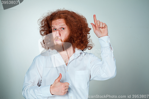 Image of Portrait of young man with shocked facial expression