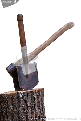 Image of Stump with axe and shovel