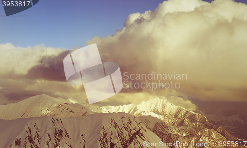 Image of Snow mountains and blue sky with clouds