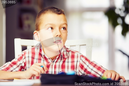 Image of Boy is doing homework 