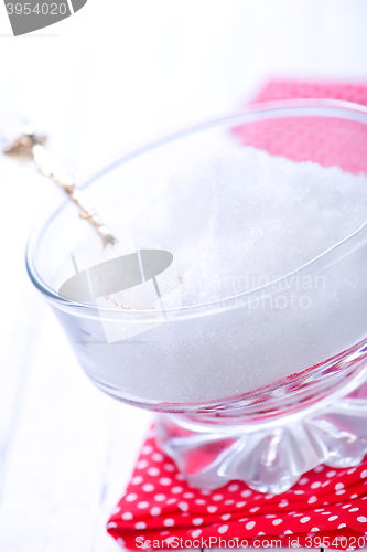 Image of white sugar in glass bank