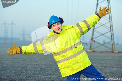 Image of Happy worker with helmet