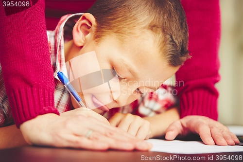 Image of Boy is doing homework 