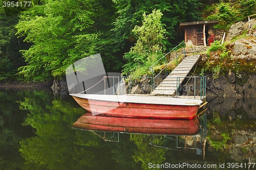 Image of Red boat on the river