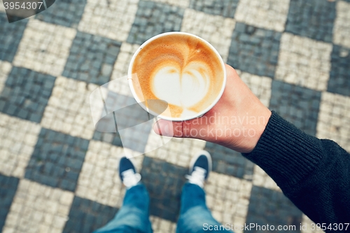 Image of Paper cup with coffee