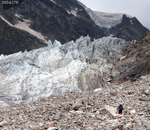 Image of Glacier and hiker on moraine