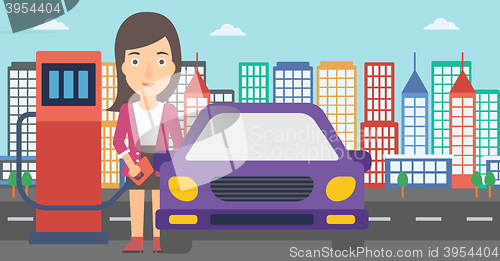 Image of Woman filling up fuel into car.